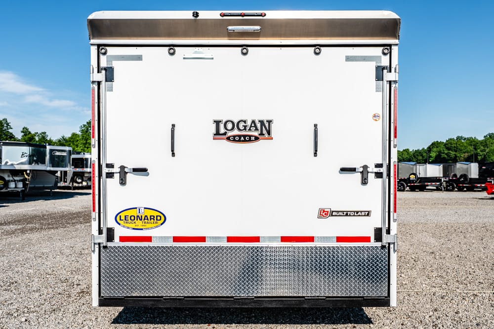 Back of a white Logan Coach trailer with metal hinges and diamond-plate bumper; visible logos include Logan Coach and Built to Last, with a Leonard sticker at lower left.