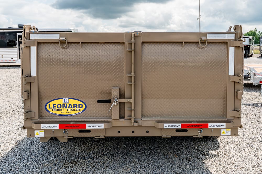 Rear view of a brown diamond-plate dump trailer with a Leonard Truck & Trailer logo on the left side panel.