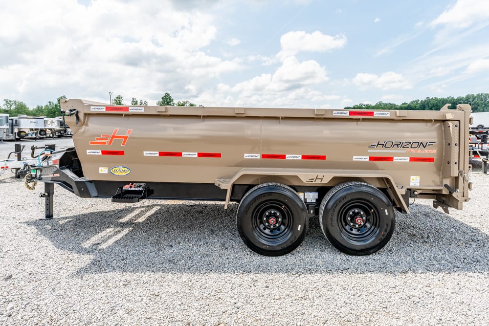 Tan Horizon dump trailer with dual wheels on a gravel lot; brand logos visible along the side.