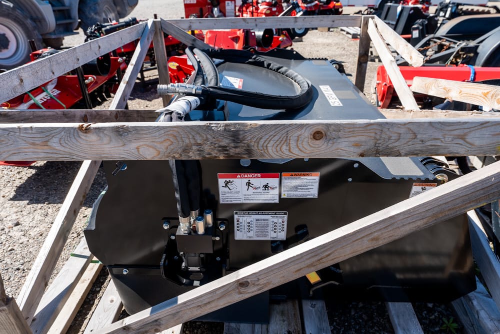 Industrial machine secured in a wooden crate with warning labels on the side