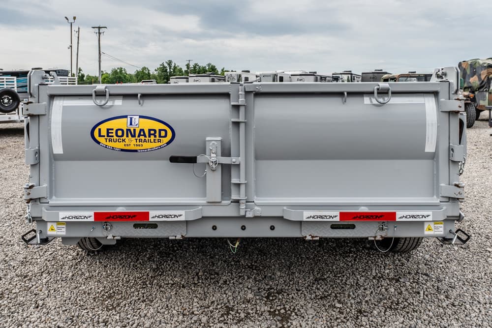 Grey rear view of a large cargo trailer on a gravel lot, showing Leonard Truck & Trailer logo and Horizon branding.