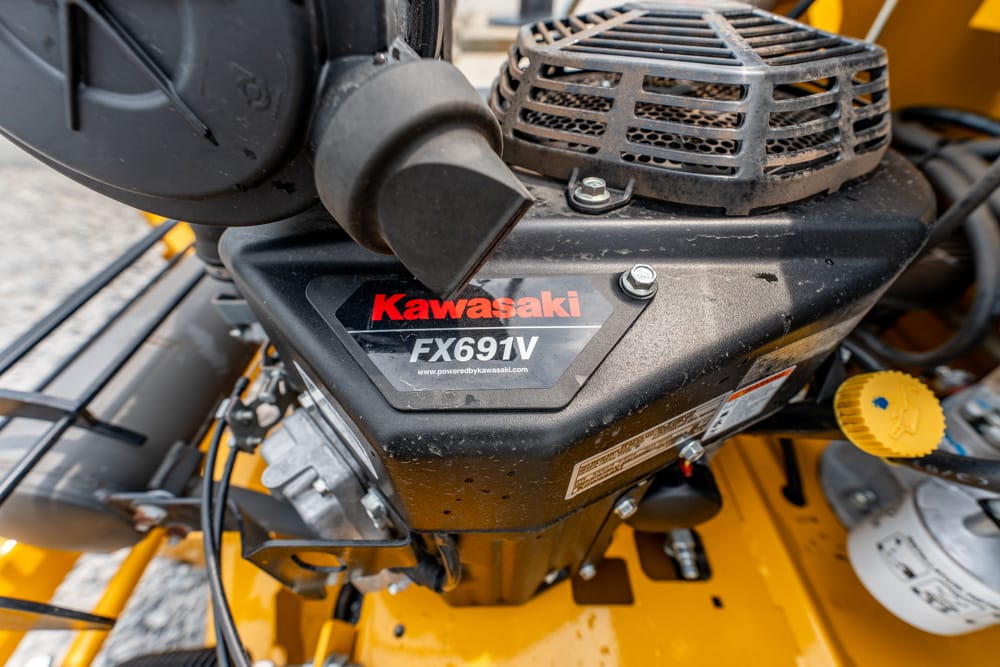 Kawasaki FX691V engine label on a yellow machine part