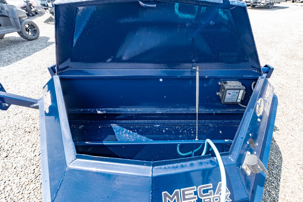 Blue metal bin with its lid open, revealing an empty interior and a control box on the right side.
