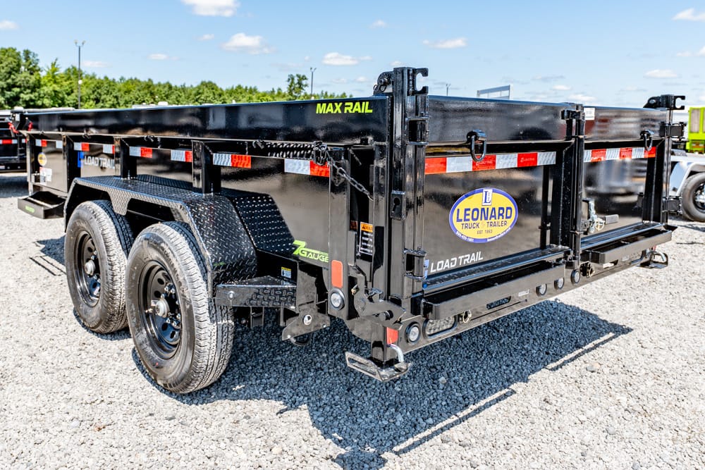 Black dual-axle dump trailer with diamond-plate fenders and Leonard Truck & Trailer logo on a gravel lot