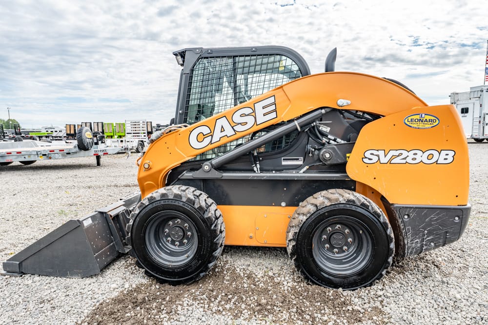 Orange CASE SV280B skid-steer loader with front bucket on a gravel lot, side view