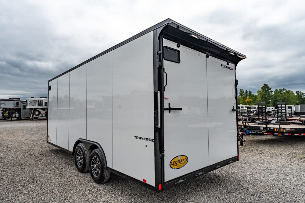 White enclosed cargo trailer with dual rear doors and black framing, Leonard logo visible on back