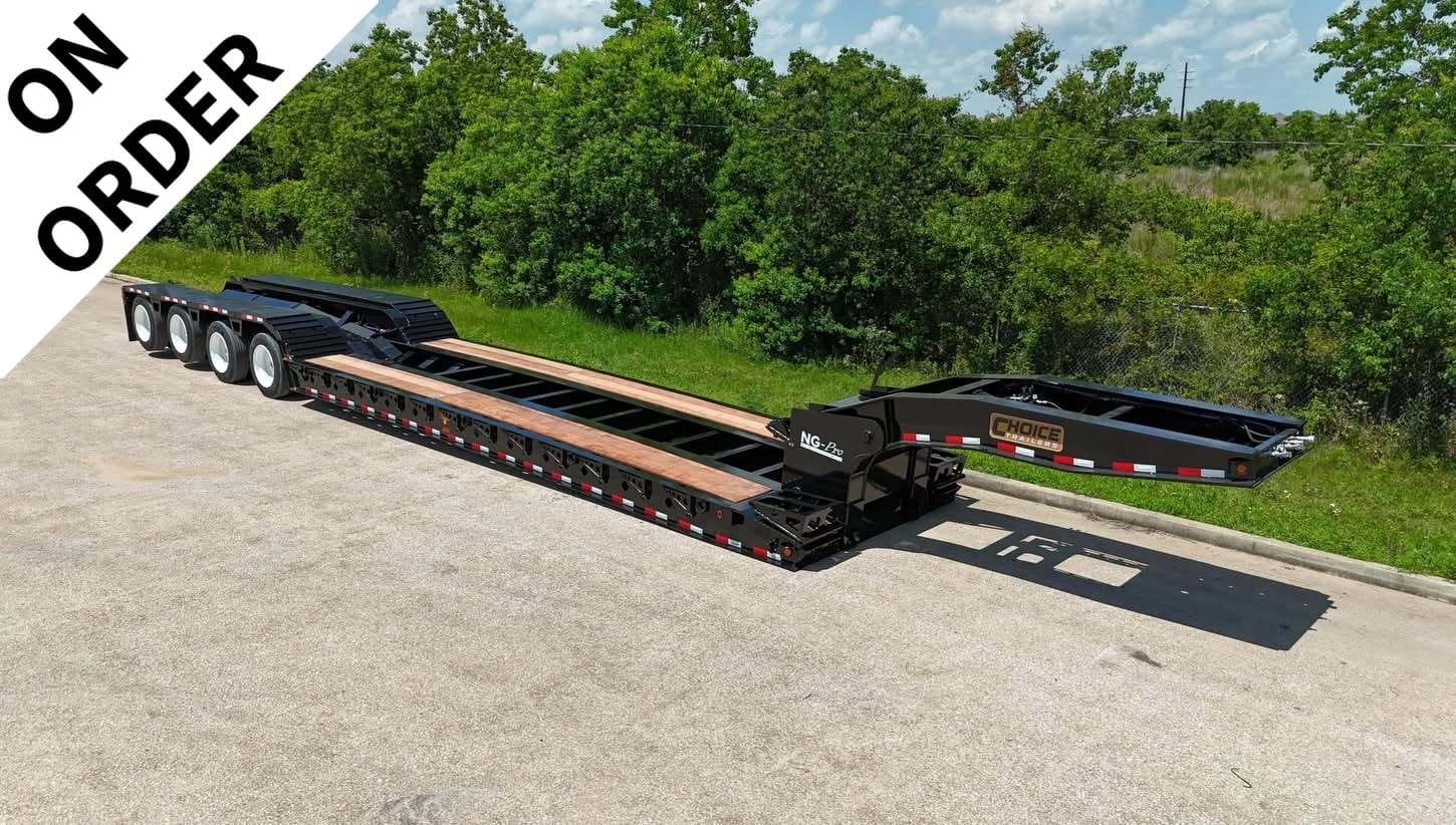 Long black lowbed trailer with a wooden deck, parked on a paved lot, and an 'ON ORDER' banner in the top-left corner.