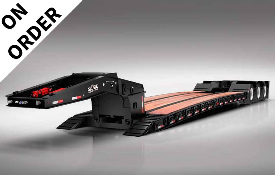 Long black lowboy trailer with a wooden deck and multiple axles, shown in a side angle, with an 'ON ORDER' banner in the top-left corner.